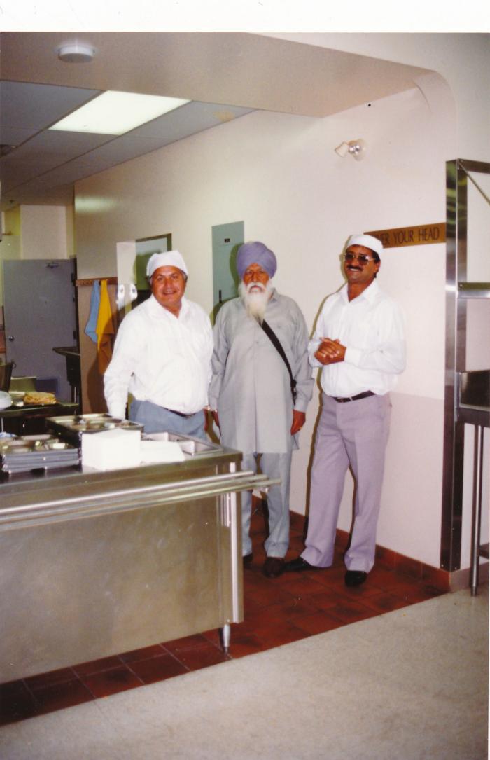 [Group photo of Ranjit Singh Nut with unidentified South Asian men in the Mission Sikh Temple]