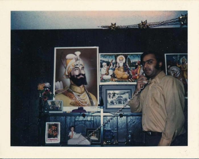 [Photo of Rajinder Singh Gill in a house in Langley]