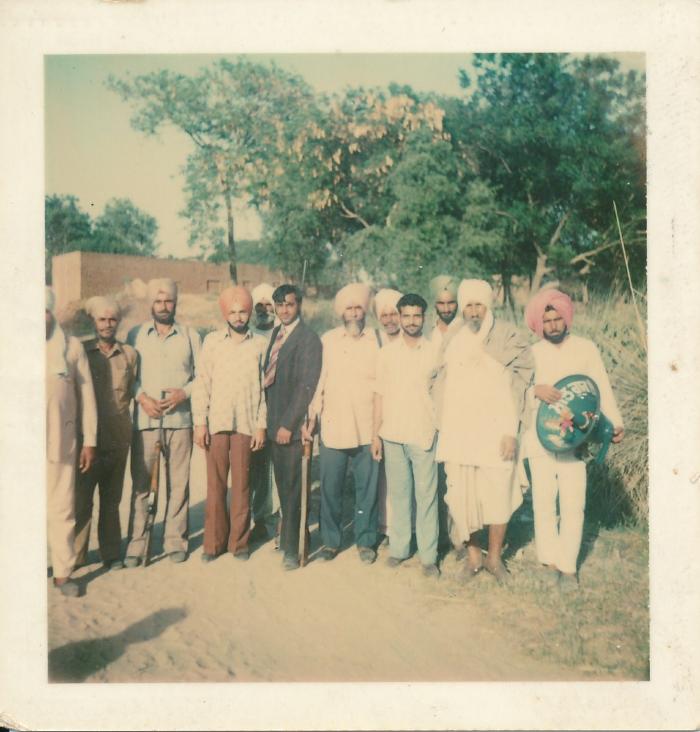 [Group photo of Rajinder Singh Gill with other unidentified South Asian men in India]