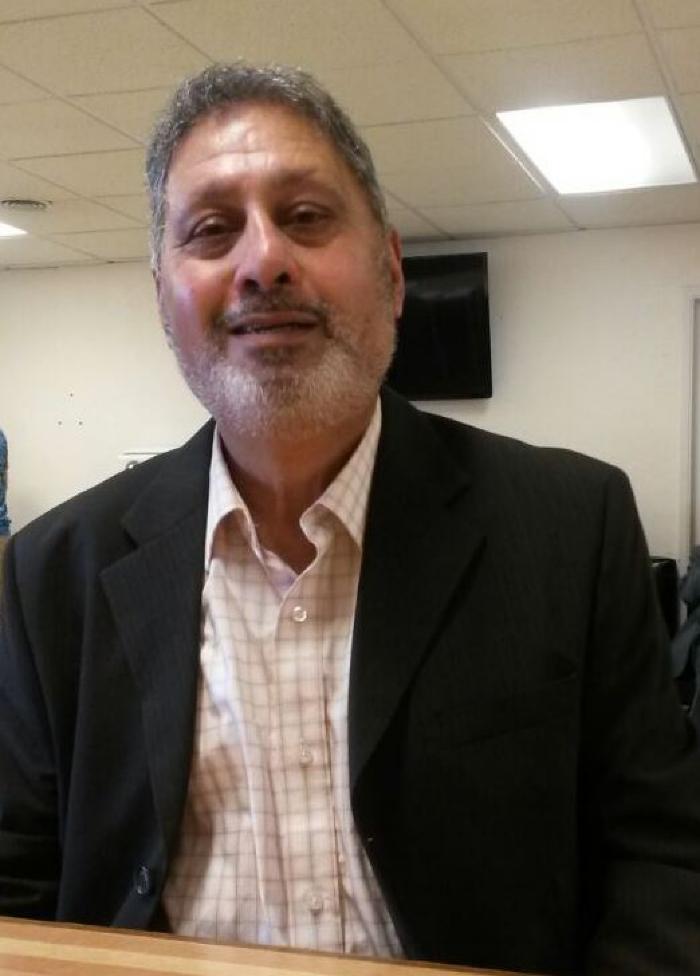 [Photo of Tarlochan Singh Basra]