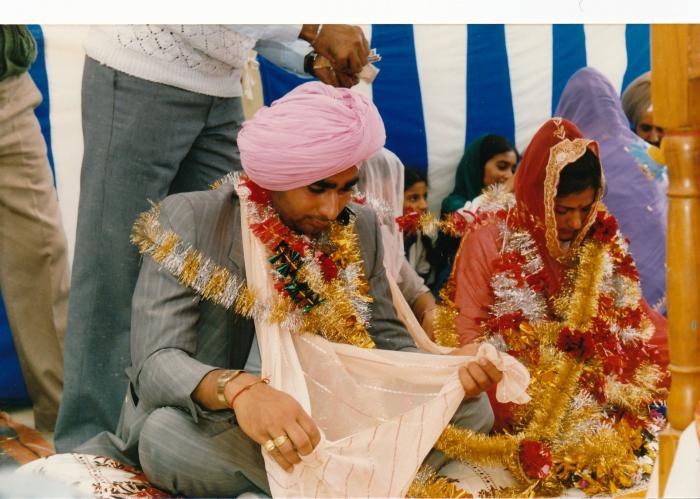 [Photo of Sukhwinder Bolla and an unidentified bride on their wedding day]