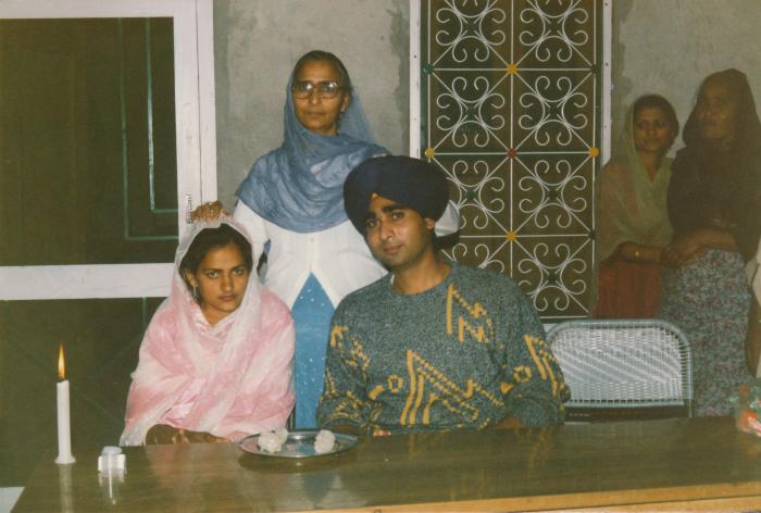 [Group photo of Sukhwinder Bolla with wife and other unidentified South Asians]