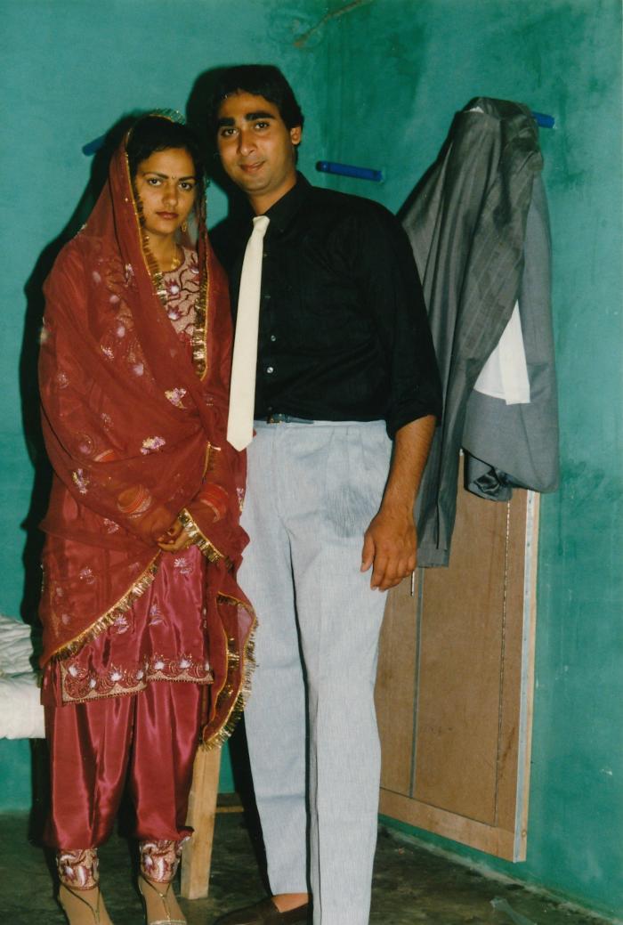 [Photo of Sukhwinder Bolla and an unidentified bride on their wedding day]