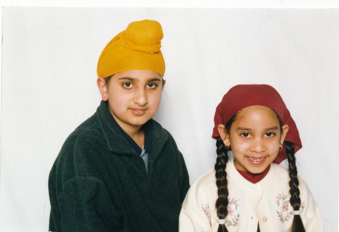 [Photo of Raj Bolla and Meena Bolla]