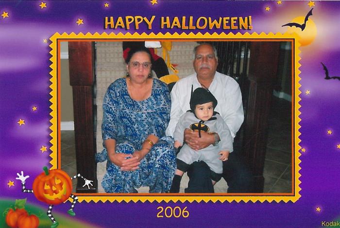 [Photo of Surjit Singh Tatla Charanjit Kaur Tatla and grandson]