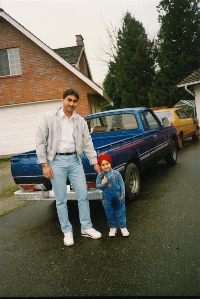 [Photo of Sukhwinder Bolla with son]