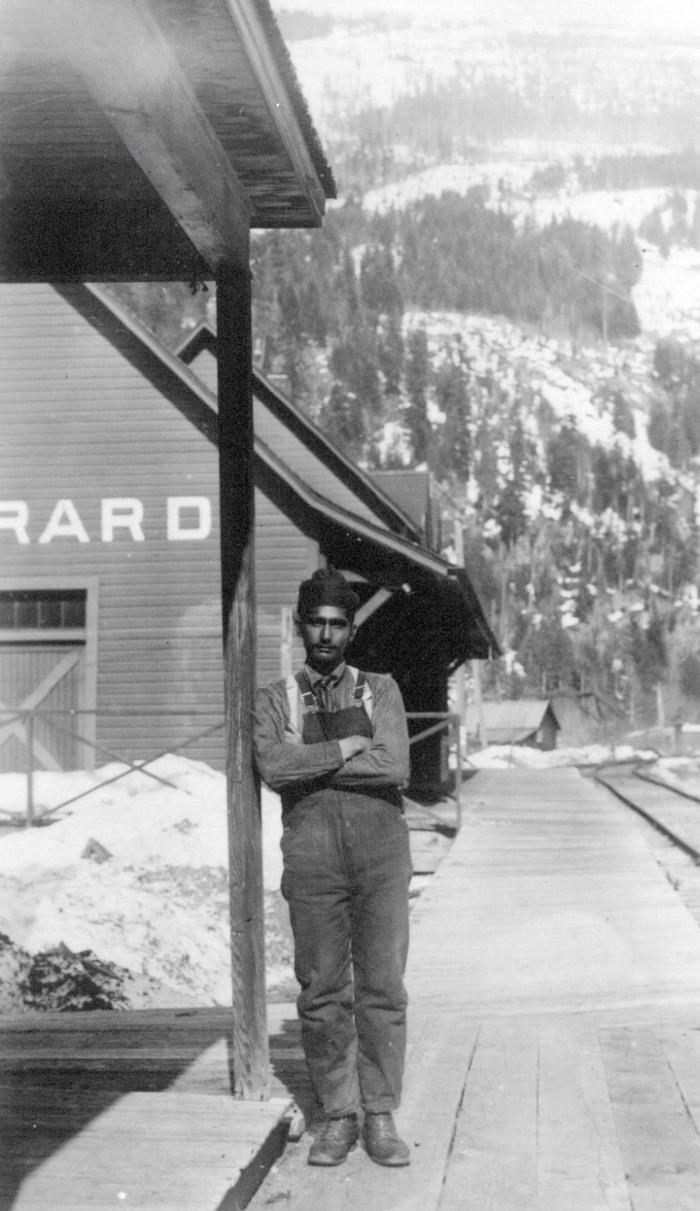 [An unidentified man standing in front of the Gerrard train station near Trout Lake, B.C.]