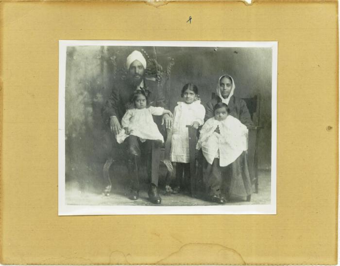 [Group photo of Hardial Singh and Rattan Kaur with their three children]