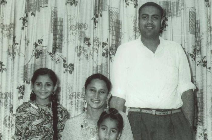 [Photo of Bachan Kaur Alamwala with her husband and two oldest children]