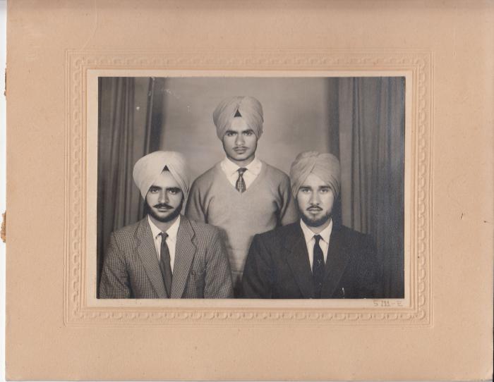 [Group photo of three men]