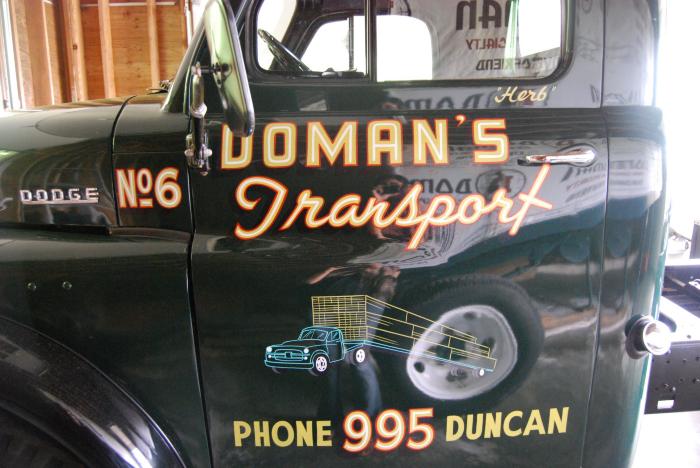 [Photo of a Doman transport truck]