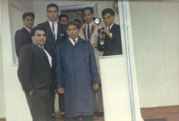 [Group photo of seven unidentified South Asian men]