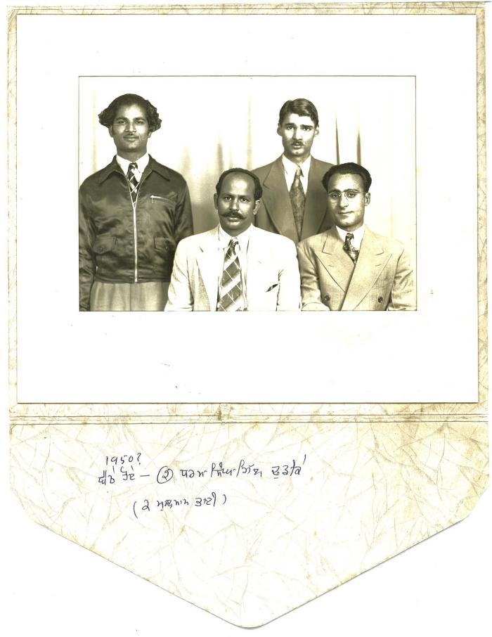 [Group photo of four men]