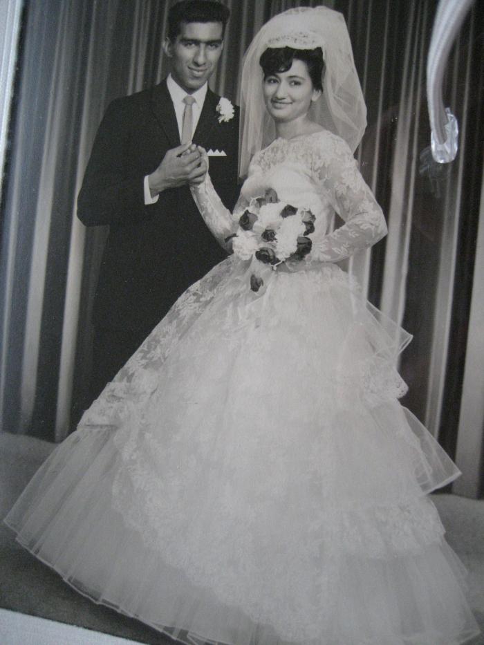 [Photo of George and Jeto on their wedding day]