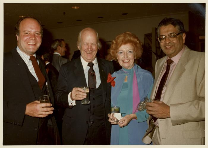 [Group photo of Herb Doman, Grace McCarthy, Ray McCarthy, and an unidentified man smiling for the camera at an unidentified party]