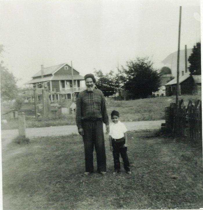 [Photo of an unidentified older man and a young child]