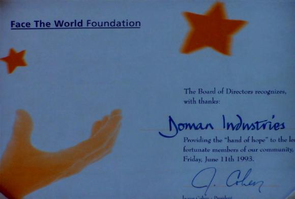 [Award presented by Face the World Foundation to Doman Industries Limited in 1993]