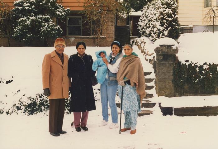 [Photograph of Dr. Gurdev Singh Gill standing with his family in front of their house in New Westminster]