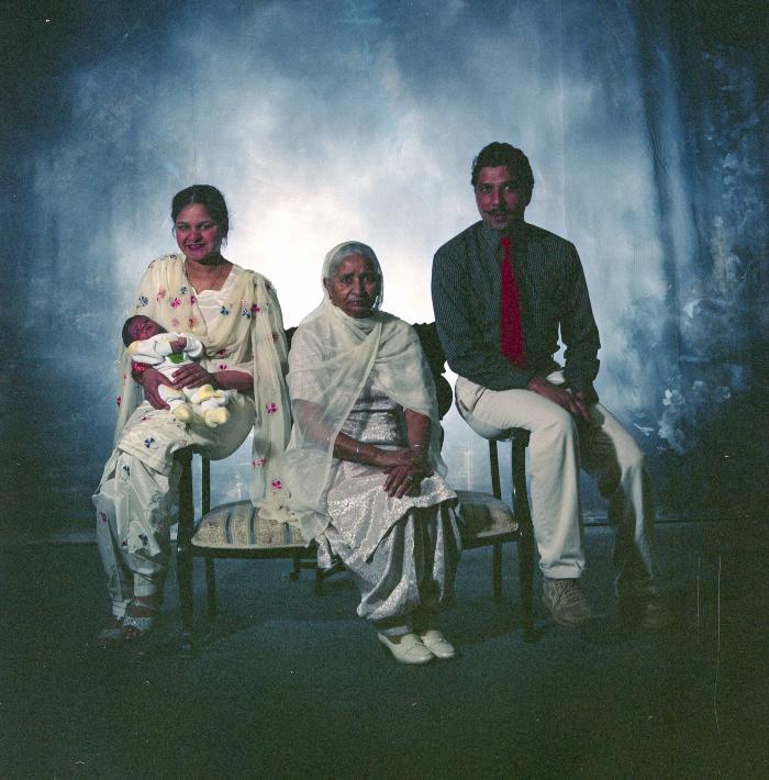 [Portrait of Amir Sandhu and three unidentified family members]