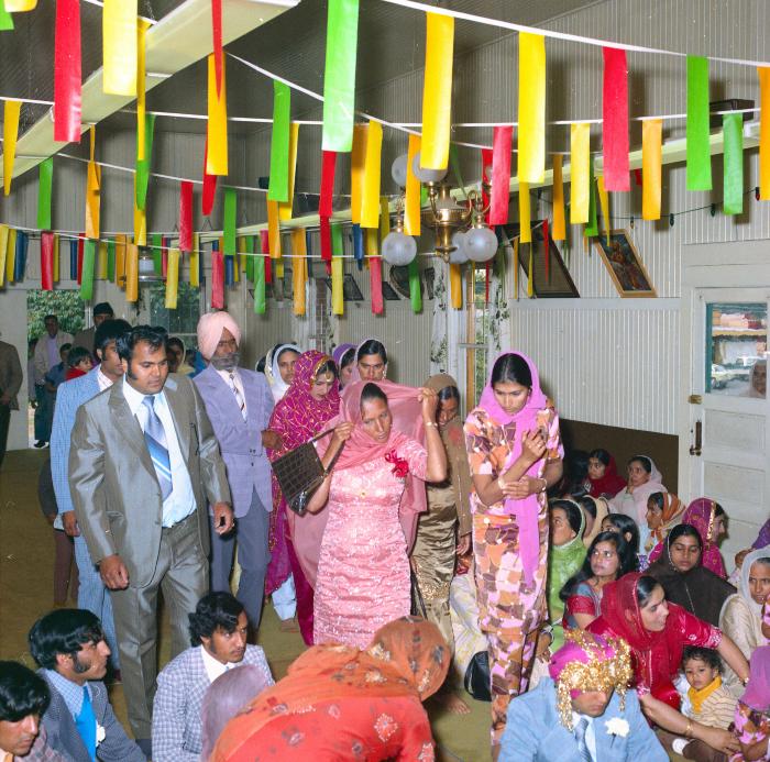 [Photo of Baldave Sidhu, Sharn Kingra and wedding guests]