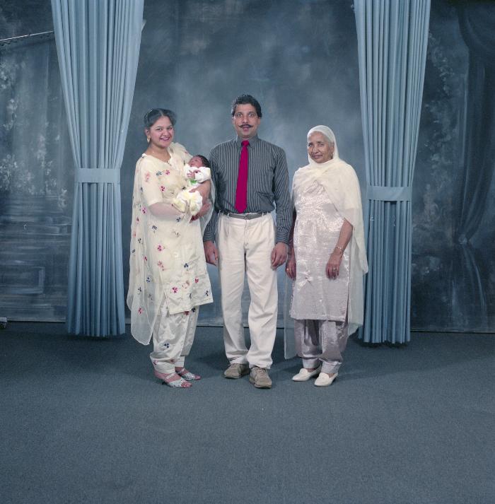 [Portrait of Amir Sandhu and three unidentified family members]