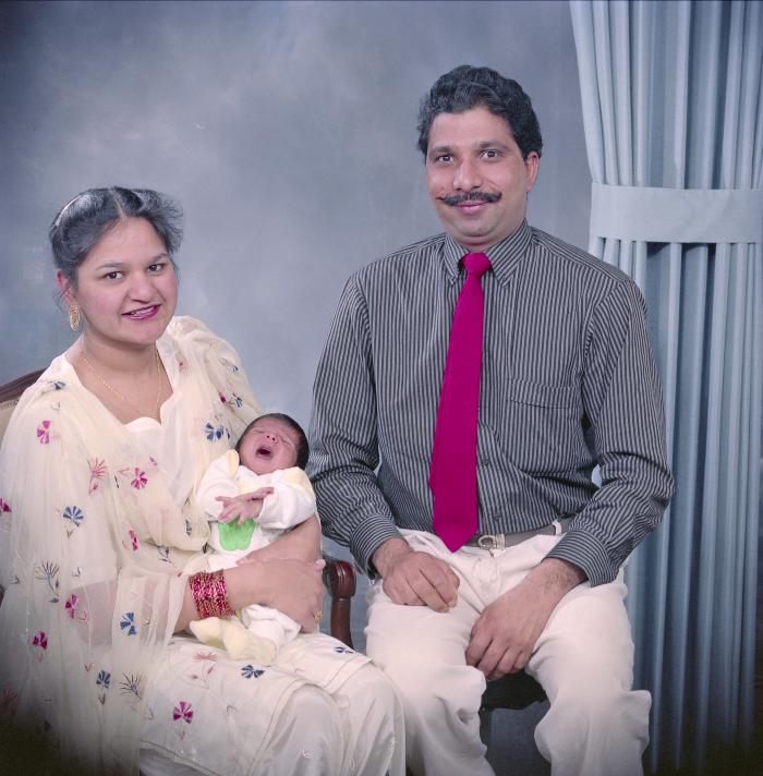 [Portrait of Amir Sandhu and two unidentified family members]