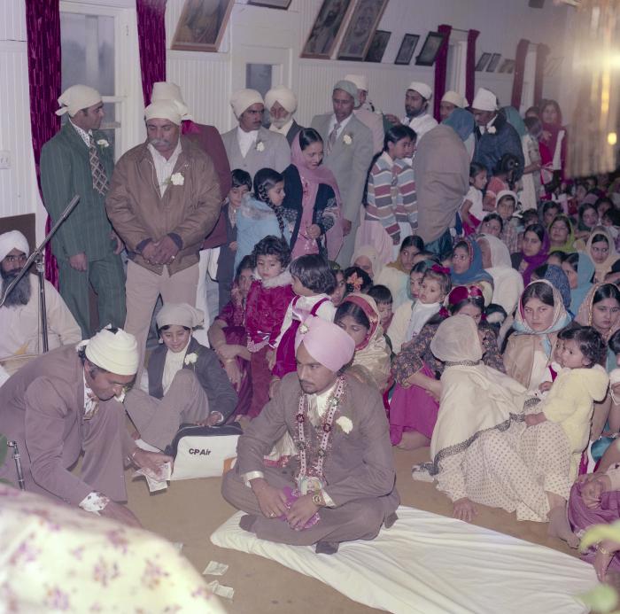 [Photo of Iqbal Sandhu and his wedding guests]