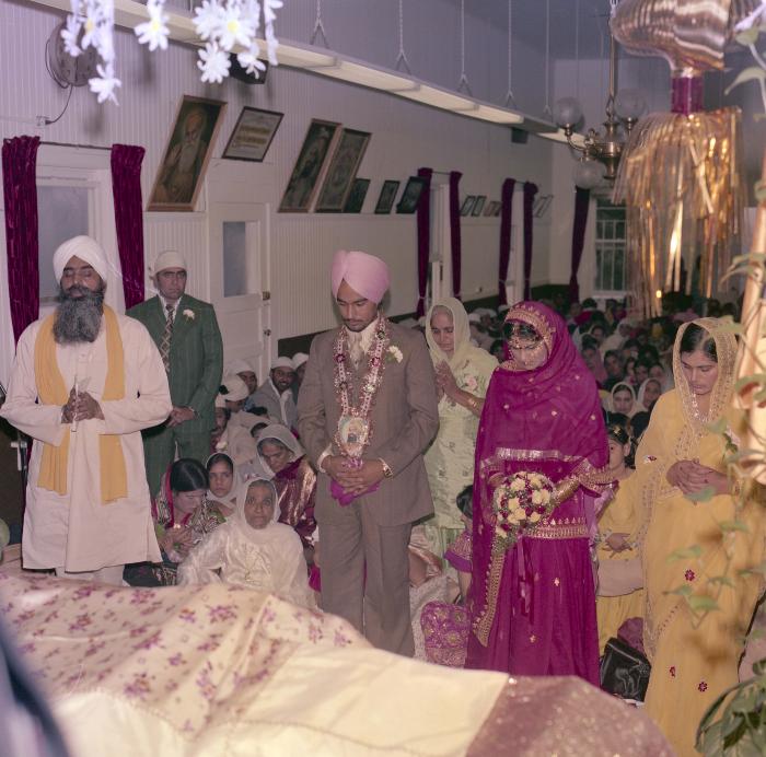 [Photo of Chindo Sidhu, Iqbal Sandhu and their wedding guests]