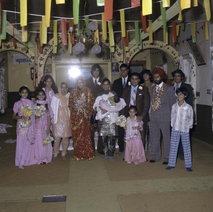 [Group photo of Gurdev S. Brar, an unidentified bride and wedding guests]