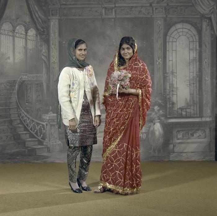 [Group portrait of an unidentified bride and an unidentified woman]