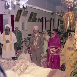 [Group portrait of Surinder Gill, G.K. Sidhu and unidentified wedding guests]