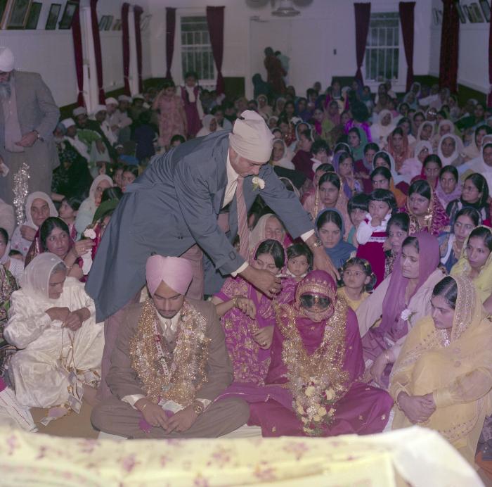 [Photo of Chindo Sidhu, Iqbal Sandhu and their wedding guests]