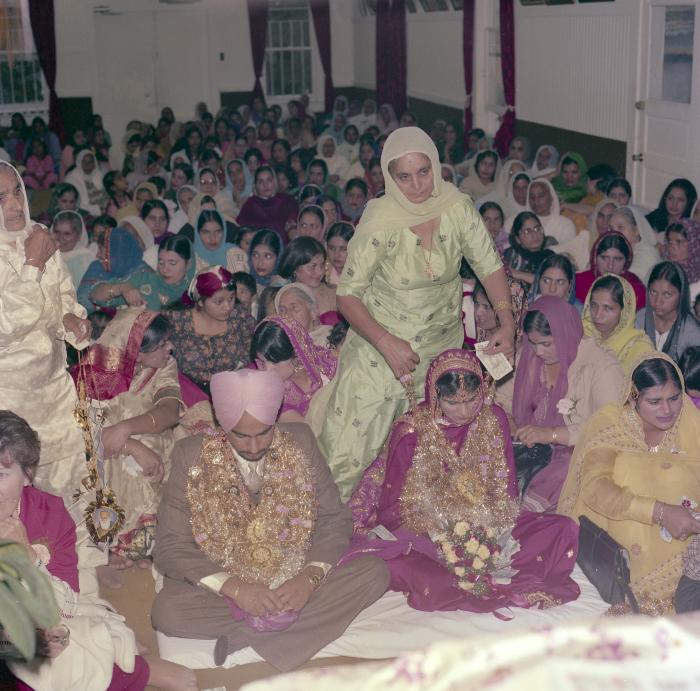 [Photo of Chindo Sidhu, Iqbal Sandhu and their wedding guests]