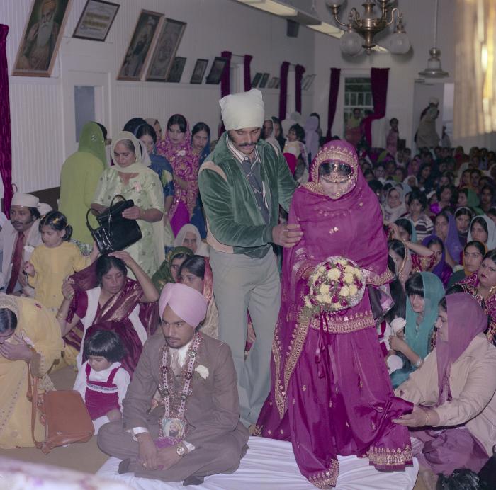 [Photo of Chindo Sidhu, Iqbal Sandhu and their wedding guests]
