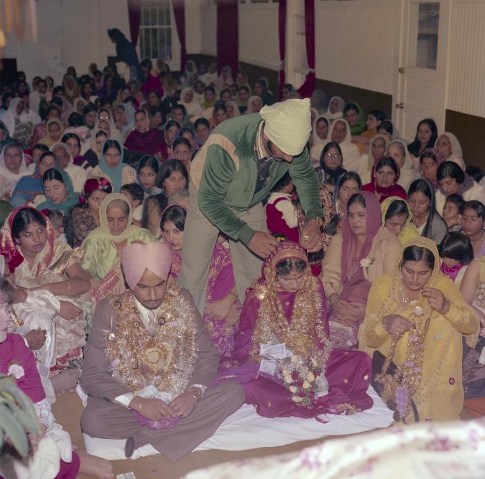 [Photo of Chindo Sidhu, Iqbal Sandhu and their wedding guests]