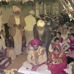 [Photo of Keher Singh, an unidentified bride and the wedding guests]