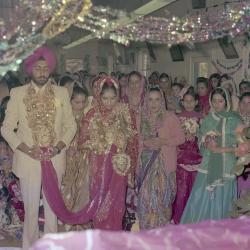 [Group photo of Surinder Sidhu, Manjit Sidhu and the wedding guests]