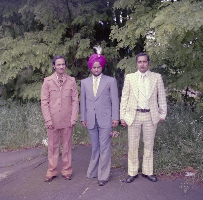 [Photo of Sekon Sarbjeet and two unidentified men]