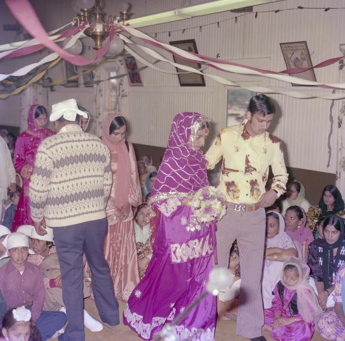 [Photo of Pritam Gill and her wedding guests]
