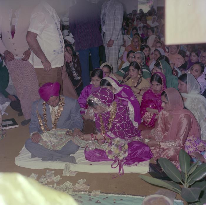 [Photo of Sekon Sarbjeet, Pritam Gill and their wedding guests]