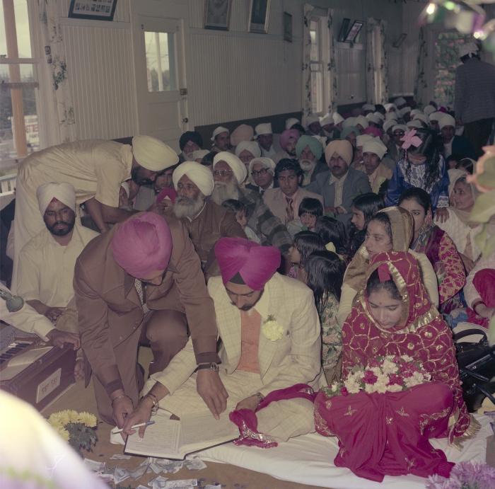[Photo of Shinder Sandhu, Jaswant Gill and their wedding guests]