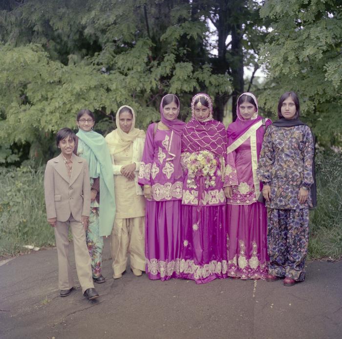 [Photo of Pritam Gill and wedding guests]