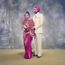 [Photo of the wedding guests in the Gurdwara facing the Granthi]