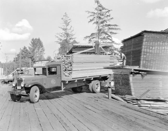 Loading lumber onto a Western Red Cedar Mills truck