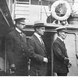 (L-R:) Inspector Reid, H.H. Stevens and Capt. Walter J. Hose on board the "Komagata Maru" in English Bay, Vancouver, British Columbia