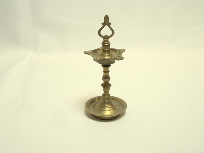 [Kuttuviḷakku = Ornamental brass lamp]