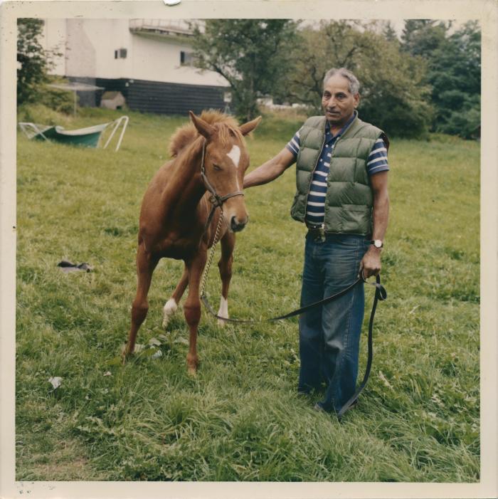 [Photo of Phangan Singh Gill with one of his foals on his farm in Port Kells, BC, circa 1990’s]