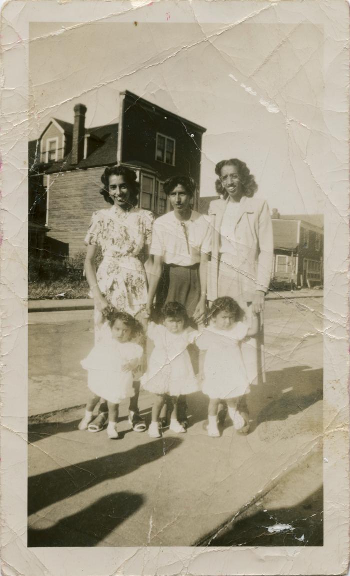 [Photo of Banto Gill with Bachan Sangha and Paula Sarai and their children]