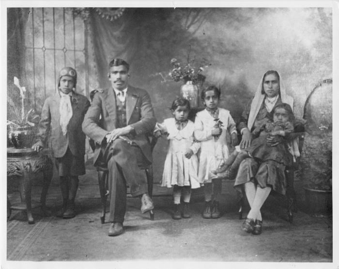 [Group photo of Gurdas Singh Johal and Bhani Kaur Johal with their children]