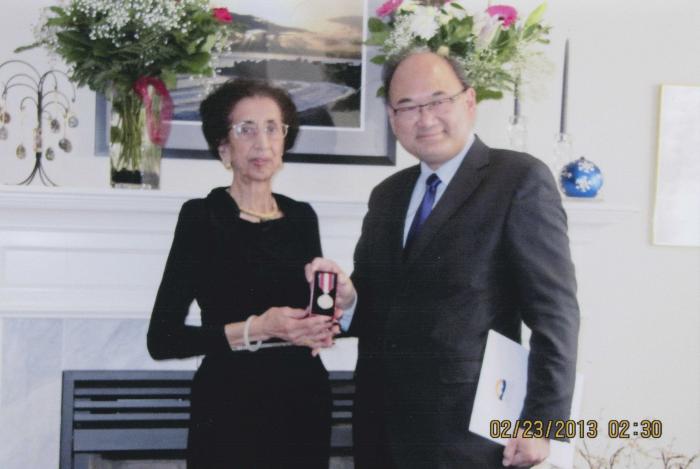 [Banto Gill being awarded with the Queen Elizabeth II Diamond Jubilee Medal]